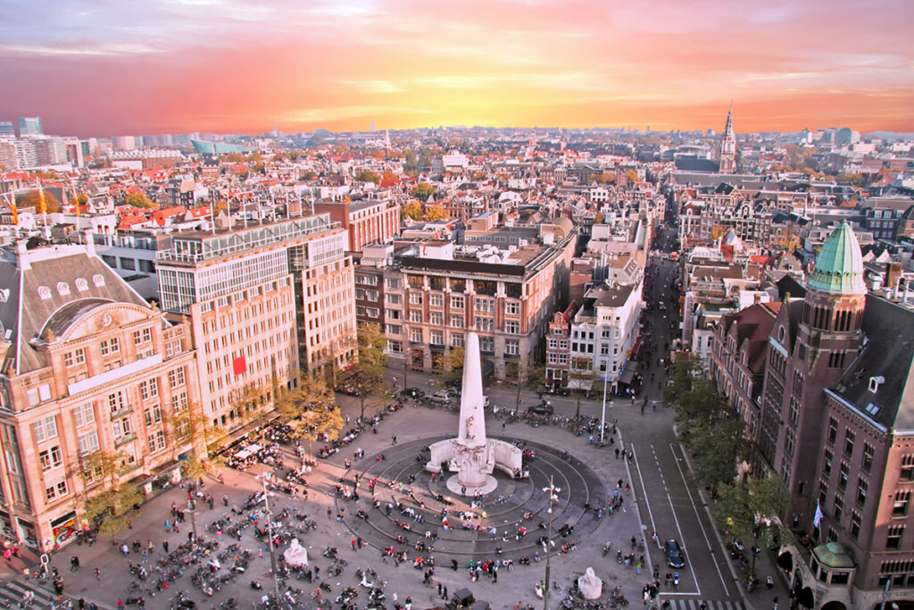 City scenic from Amsterdam with the Dam in the Netherlands at sunset