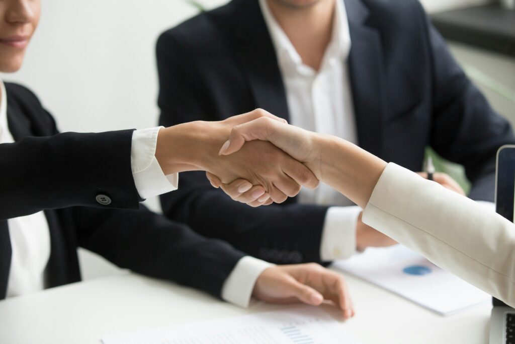 two people shaking hands